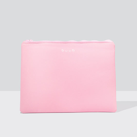 A soft pink Buub wash bag with a subtle white logo, perfect for storing beauty essentials and accessories. The rectangular cosmetic case is shown against a light grey background.